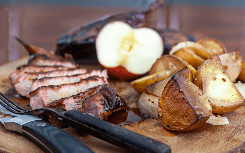 Apple smoked pork chops on a charcoal grill-11.png