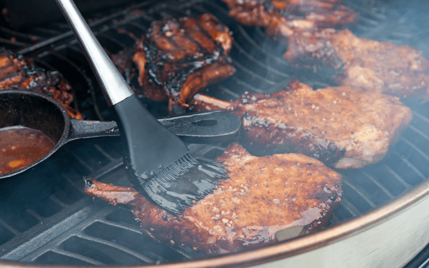 Apple smoked pork chops on a charcoal grill-9.png