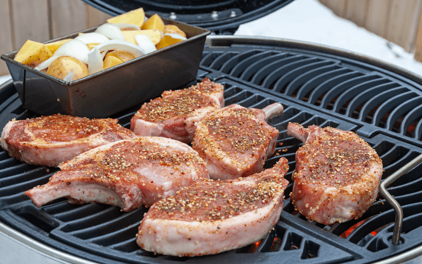 Apple smoked pork chops on a charcoal grill-3.png